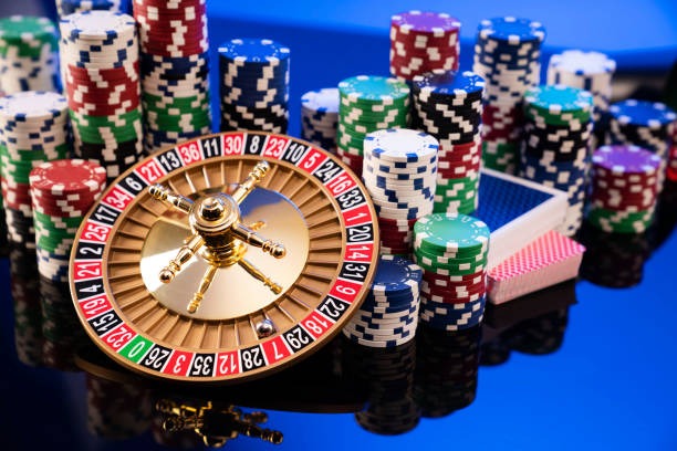 Multiple live dealer tables displayed on computer screen with chat interface visible